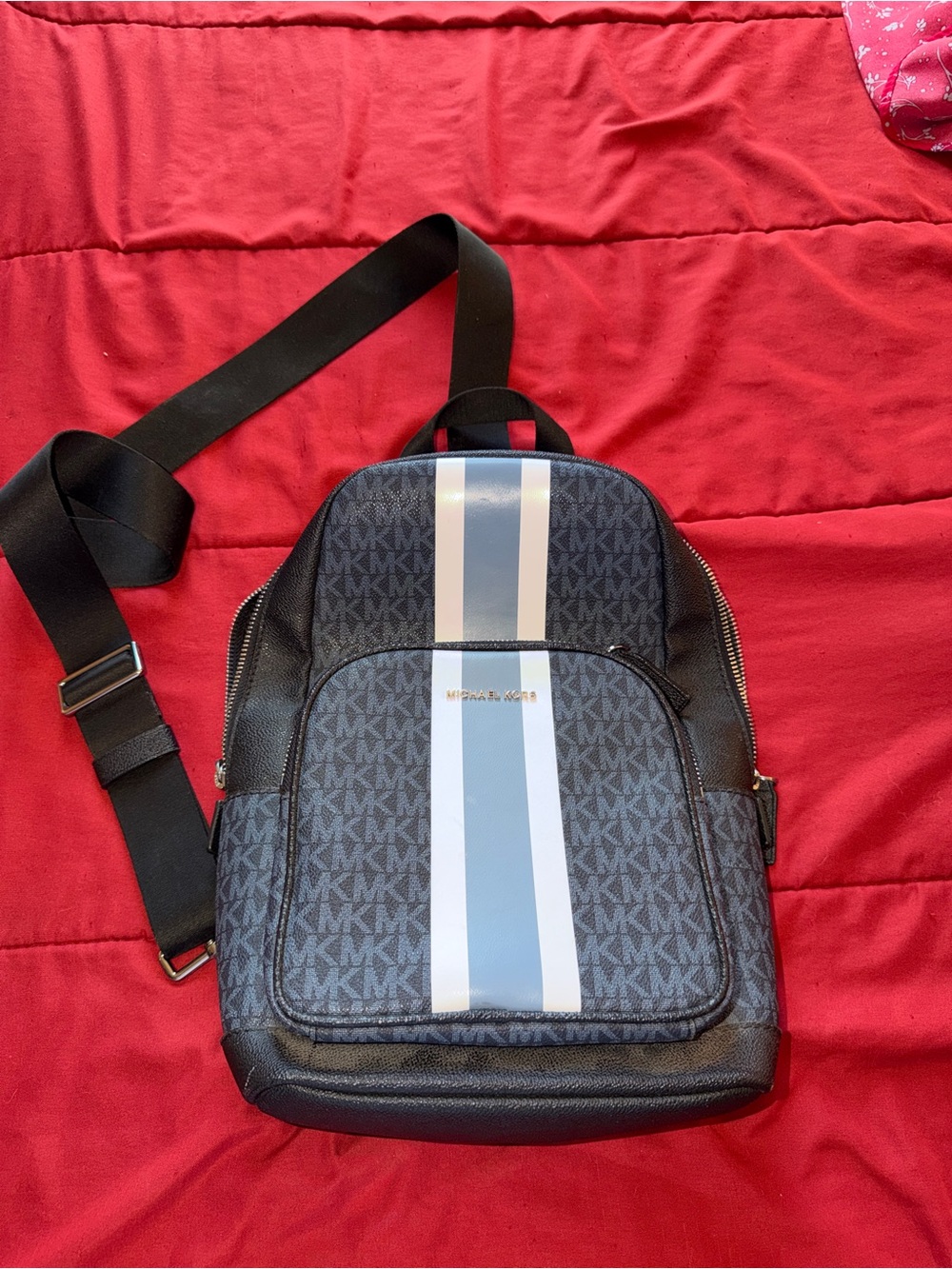 Michael Kors Navy Monogram Sling Backpack with Light Blue and White Stripes